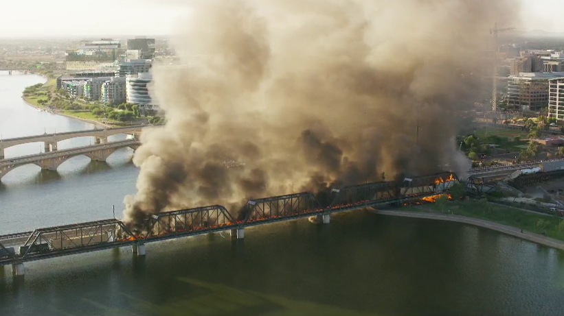 Train derailment, massive fire on bridge... 
